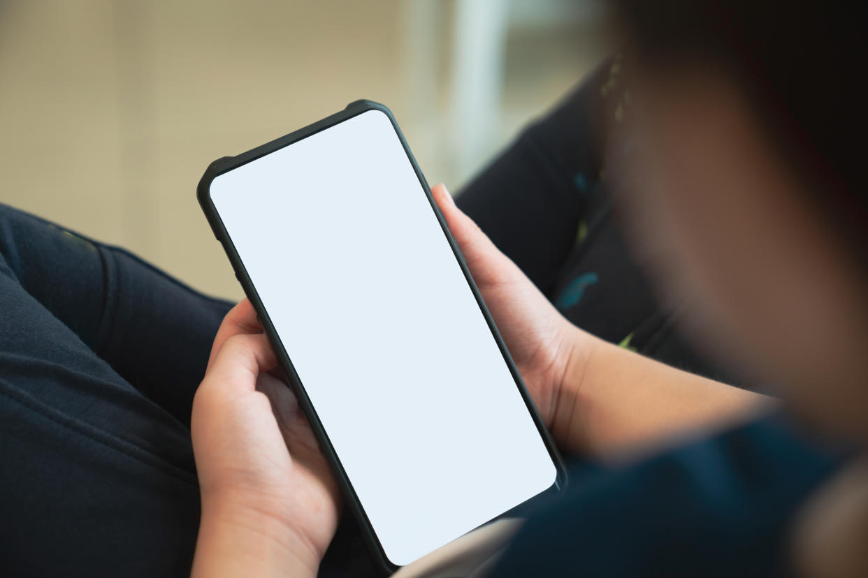 Woman looking at phone screen