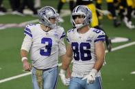 Dallas Cowboys' Garrett Gilbert (3) and Dalton Schultz (86) walk to the sideline after a pass by Gilbert was intercepted by Pittsburgh Steelers' Minkah Fitzpatrick in the end zone in the second half of an NFL football game in Arlington, Texas, Sunday, Nov. 8, 2020. (AP Photo/Ron Jenkins)