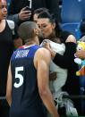 <p>Nicolas Batum of France meets Aurelie and their 7 months old baby son Ayden Richard Batum following the men’s basketball match between France and Serbia on day 5 of Rio 2016 Olympic Games at Carioca Arena 1 on August 10, 2016 in Rio de Janeiro, Brazil. (Photo by Jean Catuffe/Getty Images) </p>