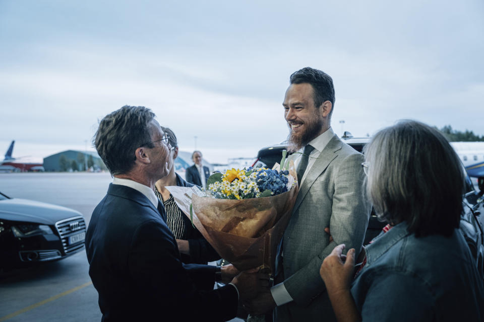 In this photo provided by the Swedish government, Johan Floderus, right, speaks with Swedish Prime Minister Ulf Kristersson at Arlanda airport in Stockholm, Sweden on Saturday, June 15, 2024, after being released from prison in Iran. (Tom Samuelsson/Swedish government/TT News Agency via AP)