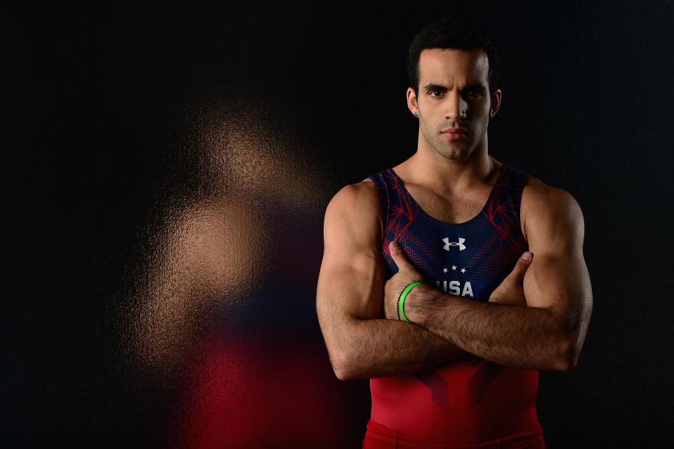 Danell with his arms crossed over his chest wearing a USA Olympic uniform