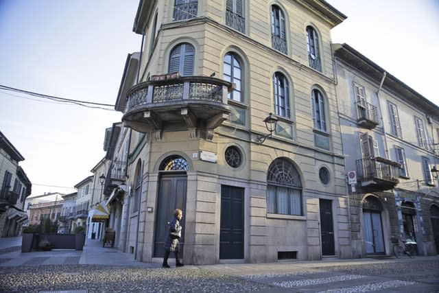 A woman walks in a street in the centre of Codogno, near Lodi in northern Italy