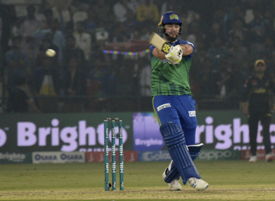 Rilee Rossouw of Multan Sultans plays a pull shot as he scores unbeaten 49 against Peshawar Zalmi in the Pakistan Super League match in Multan, Pakistan, Wednesday, Feb 26, 2020. Multan Sultan beat Peshawar Zalmi by six wickets. (AP Photo/Asim Tanveer)