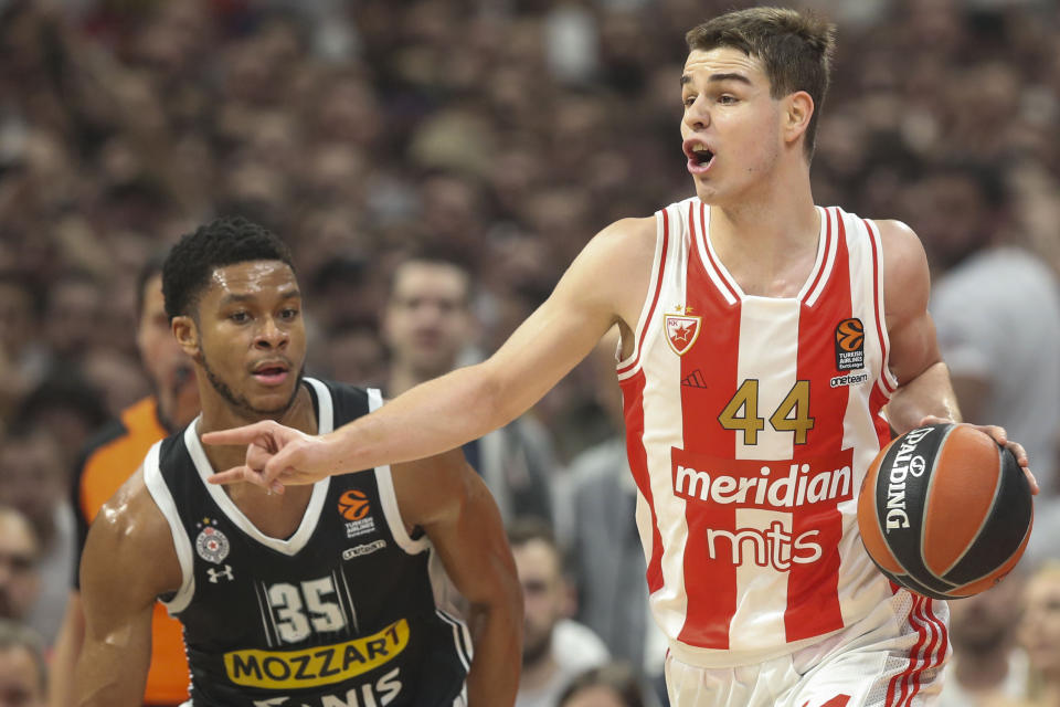 FILE - Red Star's Nikola Topic, right, drives to the basket during the Euroleague basketball match between Red Star and Partizan, in Belgrade, Serbia, Jan. 4, 2024. Topic is among the headliners of the guards in the upcoming NBA draft.(AP Photo, File)