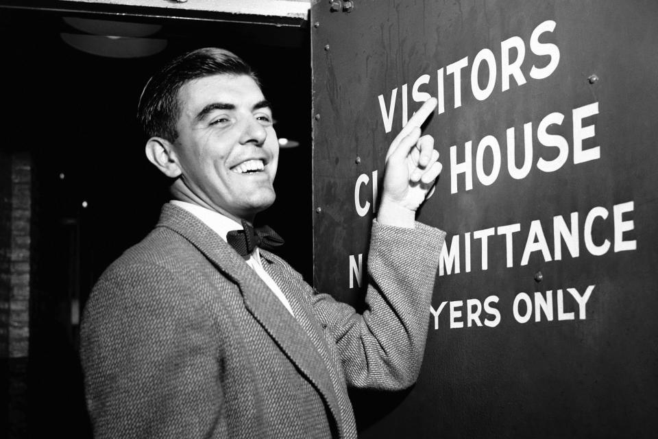 FILE - Philadelphia Phillies pitcher Curt Simmons gestures towards a door at Ebbets Field in Brooklyn, N.Y, Aug. 9, 1950. Simmons, the last surviving member of the 1950 Philadelphia Phillies “Whiz Kids” team, died Tuesday, Dec. 13, 2022 in Ambler, Pa. He was 93. (AP Photo/File)