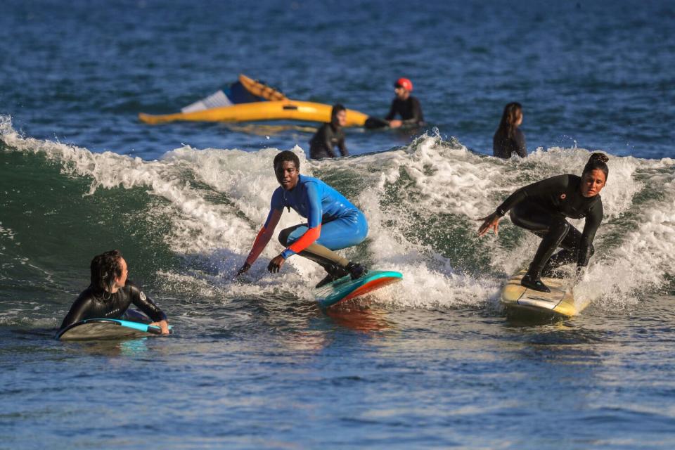 Multiple surfers in the ocean