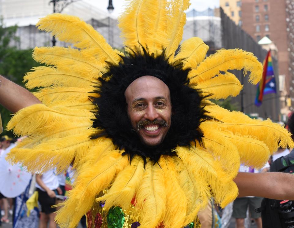 <p>People take part in the annual 2018 New York City Pride Parade on June 24, 2018 as they make their way down 7th Avenue in New York. (Photo: Timothy A. Clary/AFP/Getty Images) </p>