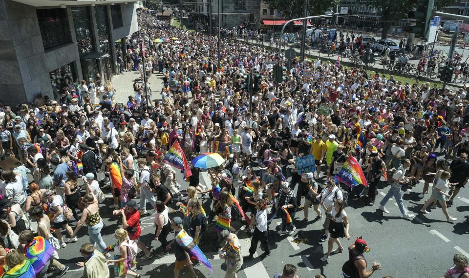 Participants of the Cologne Pride rally march through the city center in Cologne, Germany, Sunday, July 3, 2022. This year's Christopher Street Day (CSD) Gay Parade with thousands of demonstrators for LGBTQ rights is the first after the coronavirus pandemic to be followed by hundreds of thousands of spectators in the streets of Cologne. (AP Photo/Martin Meissner)