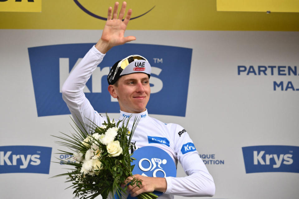 UAE Team Emirates' Slovenian rider Tadej Pogacar celebrates on the podium with the best young rider's white jersey after the 16th stage of the 110th edition of the Tour de France cycling race, 22 km individual time trial between Passy and Combloux, in the French Alps, on July 18, 2023. (Photo by Marco BERTORELLO / AFP)