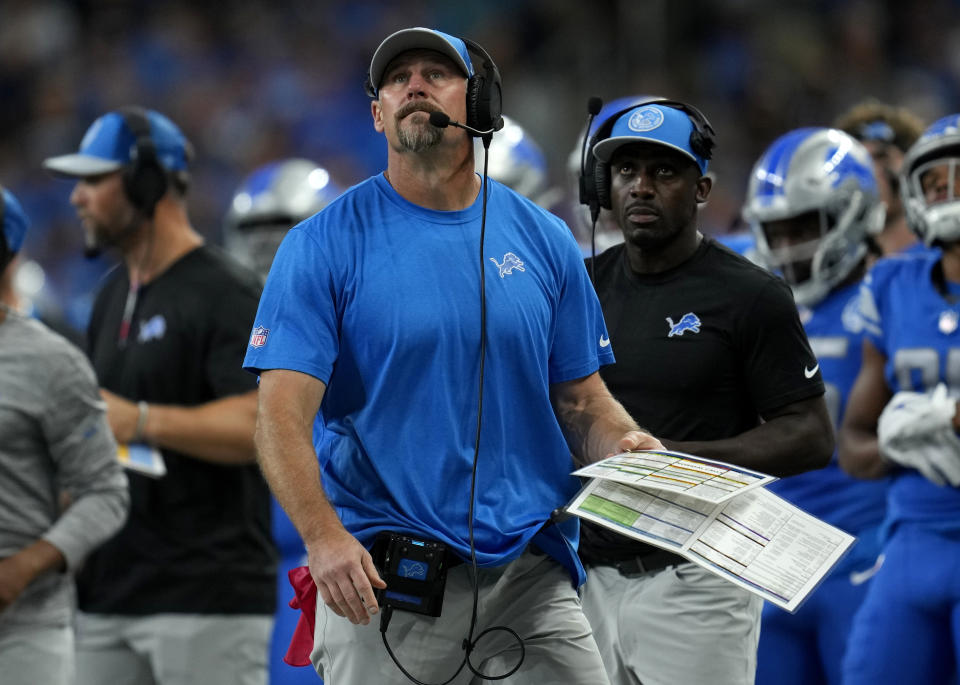 Detroit Lions head coach Dan Campbell, center, watches from the sideline in the first half of an NFL football game against the Atlanta Falcons, Sunday, Sept. 24, 2023, in Detroit. (AP Photo/Paul Sancya)