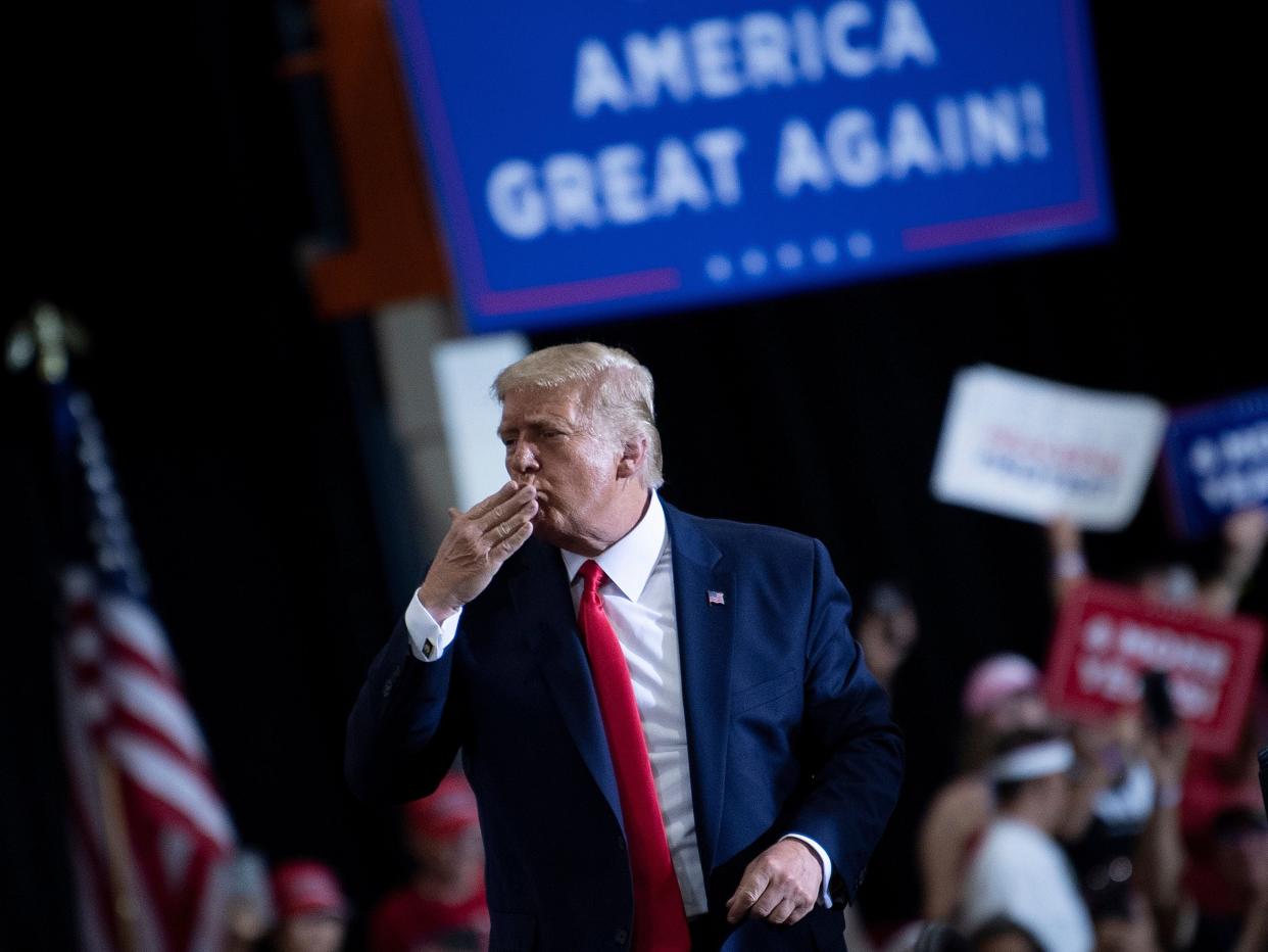 US President Donald Trump blows a kiss to supporters after speaking during an indoor campaign rally at Xtreme Manufacturing in Henderson, a suburb of Las Vegas, Nevada (AFP via Getty Images)