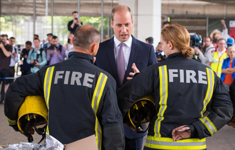 LONDON, ENGLAND - JUNE 16:  Prince William, Duke of Cambridge meets firefighters and paramedics during a visit to the Westway Sports Centre which is providing temporary shelter for those who have been made homeless in the disaster on June 16, 2017 in London, England. 30 people have been confirmed dead and dozens still missing, after the 24 storey residential Grenfell Tower block in Latimer Road was engulfed in flames in the early hours of June 14. Emergency services will spend a third day searching through the building for bodies. Police have said that some victims may never be identified.  (Photo by Dominic Lipinski - WPA Pool /Getty Images)