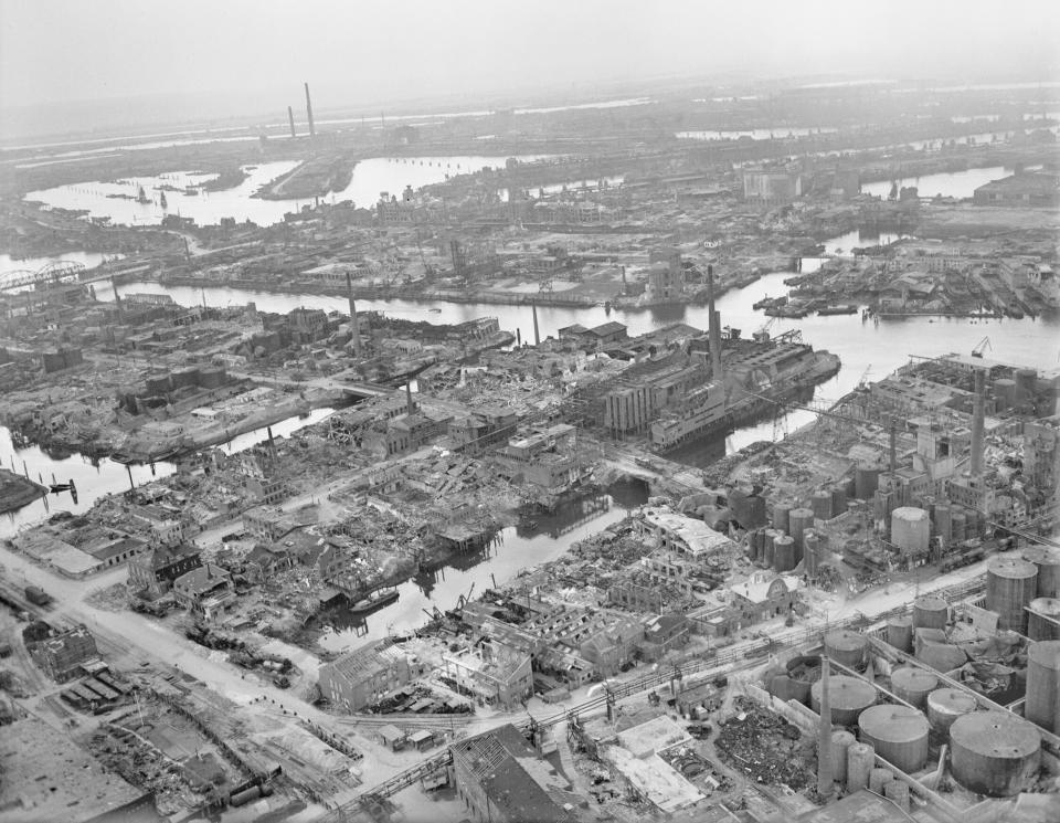 An oblique aerial view of severely damaged docks in the Steinwerder district of Hamburg, looking southwest from over the Rive Elbe. The area was subjected to repeated attacks by Bomber Command and USAAF raids. <em>Crown Copyright</em>