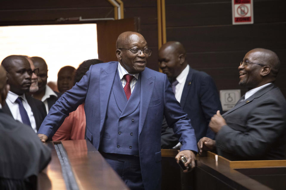 Former South African President Jacob Zuma, centre, arrives at the Pietermaritzburg High Court in South Africa, Monday, April 17, 2023. The corruption trial of Zuma was postponed again as he seeks to have the lead prosecutor removed from the case by claiming he is biased. (Kim Ludbrook/Pool via AP)