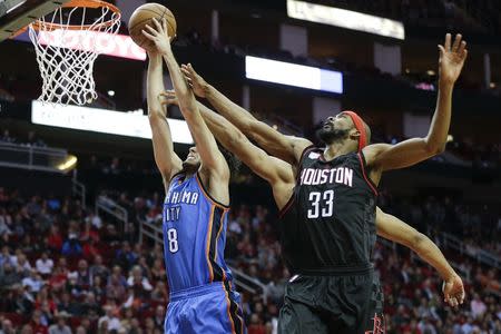 Jan 5, 2017; Houston, TX, USA; Oklahoma City Thunder guard Alex Abrines (8) drives against Houston Rockets forward Corey Brewer (33) in the second half at Toyota Center. Houston Rockets won 118 to 116. Thomas B. Shea-USA TODAY Sports