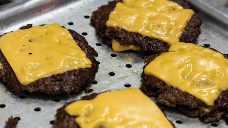 tray of cooked cheeseburgers