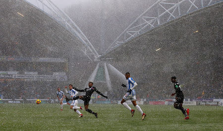 Soccer Football - Premier League - Huddersfield Town vs Crystal Palace - John Smith's Stadium, Huddersfield, Britain - March 17, 2018 General view of the action as the snow falls Action Images via Reuters/Craig Brough