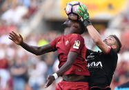 <p>AS Roma’s Antonio Rudiger and Genoa’s goalkeeper Eugenio Lamanna go after the ball during an Italian Serie A soccer match in Rome, Italy, May 28, 2017. (Photo: Alberto Lingria/Reuters) </p>