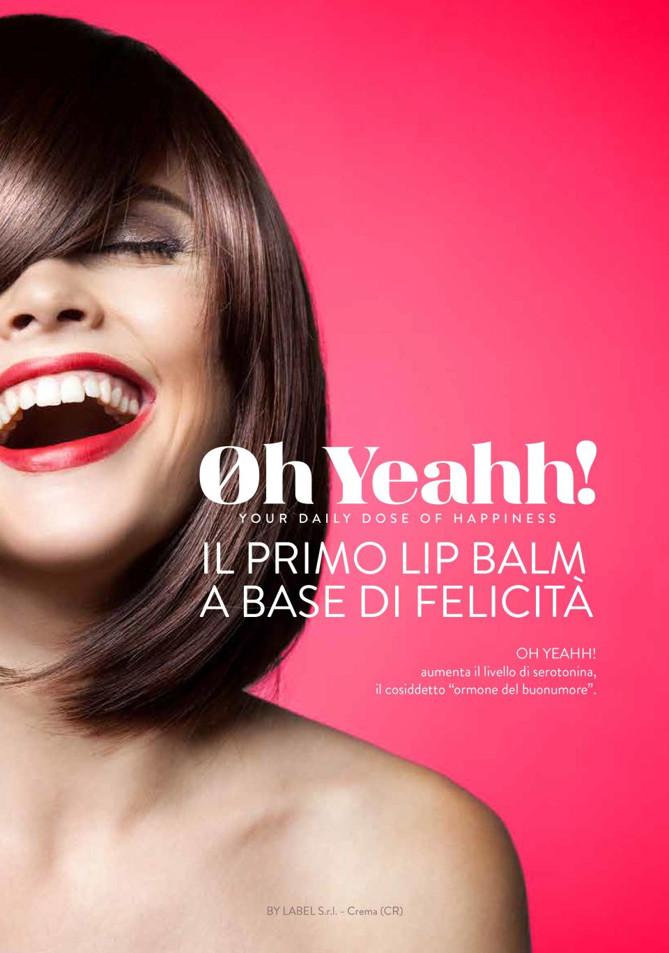An advertisement for the brand in Italian that reads: "Il primo lip balm a base di felicità," or "the first lip balm based on happiness."