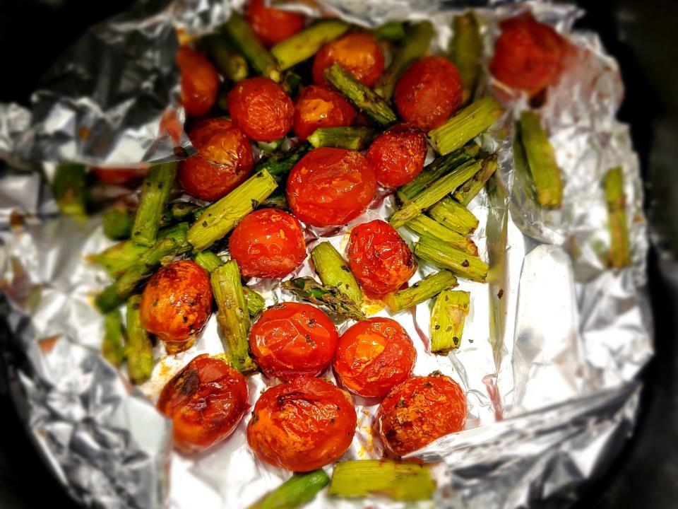 asparagus and tomatoes on foil in air fryer