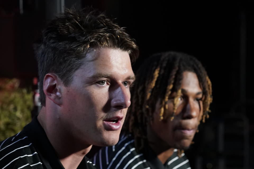 Oregon State tight end Luke Musgrave, left, and defensive back Alex Austin attend the Pac-12 Conference NCAA college football media day Friday, July 29, 2022, in Los Angeles. (AP Photo/Damian Dovarganes)