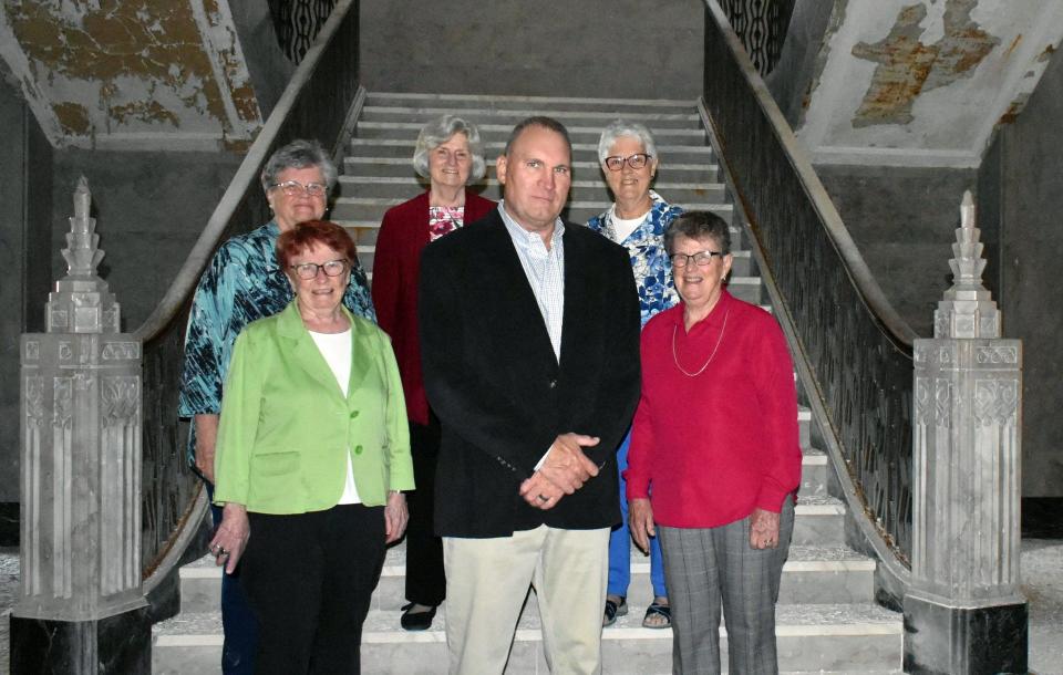 Keith Masserant (front row, center) is shown in front of St. Mary Academy's iconic marble staircase with members of the IHM Leadership Council: Sister Pat McCluskey (to the left of Masserant) and (clockwise) Sisters Marianne Gaynor, Ellen Rinke, Margaret Chapman and Mary Jane Herb.