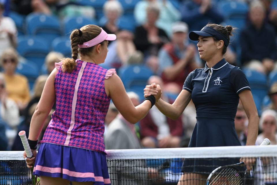 Jelena Ostapenko and Ajla Tomljanovic, pictured here shaking hands after the match in Eastbourne.