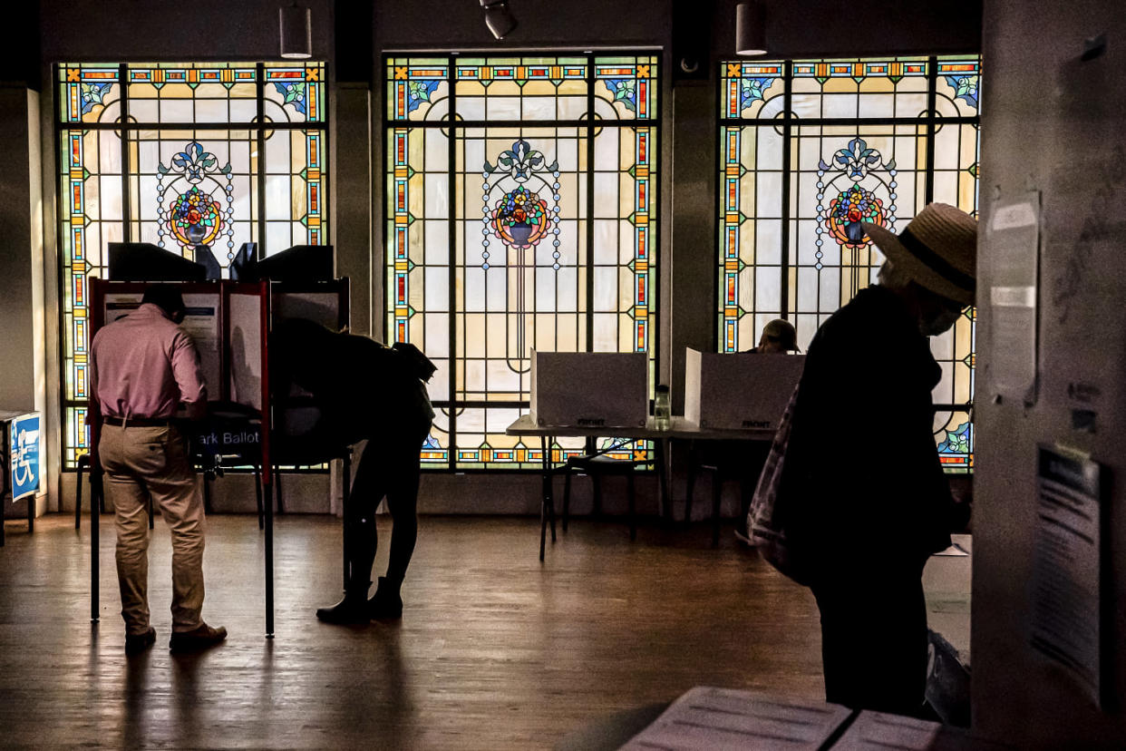 Image: Voters cast their ballots at a polling location inside the Museum of Contemporary Art on Nov. 8, 2022 in Arlington, Va. (Nathan Howard / Getty Images file)