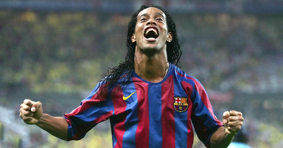 Barcelona's Brazilian forward Ronaldinho celebrates after winning the UEFA Champion's League final football match against Arsenal, 17 May 2006 at the Stade de France in Saint-Denis, northern Paris. Barcelona won 2 to 1. AFP PHOTO LLUIS GENE