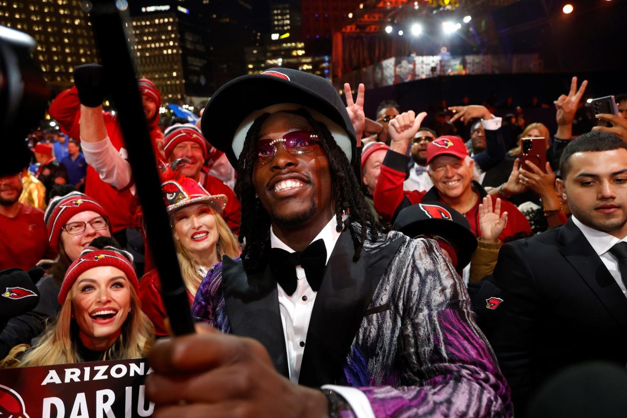 Darius Robinson, a defensive lineman from the University of Missouri uses a selfie stick with his new fans in the Arizona Cardinals after he was picked in the first round of the 2024 NFL draft at the NFL draft theater in Detroit on Thursday, April 25, 2024.