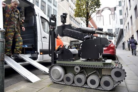 A bomb disposal robot is deployed during an alert in Brussels, Belgium, November 16, 2015, following the deadly attacks in Paris. REUTERS/Eric Vidal