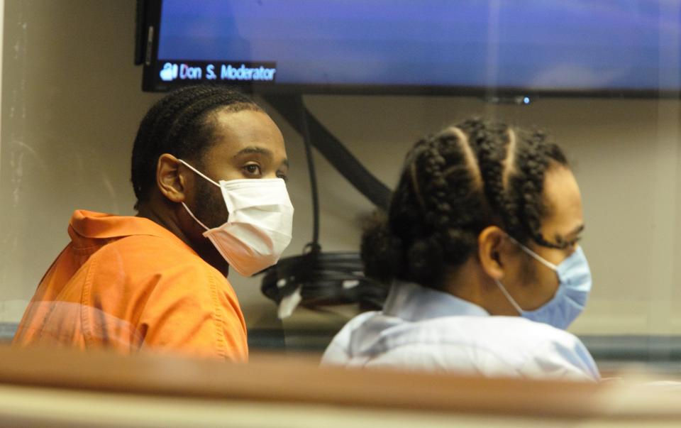 Jamaal Mellish, at left, sits next to co-defendant Hannan Aiken during a hearing in state Superior Court in Sussex County on Friday, Feb. 19, 2022.