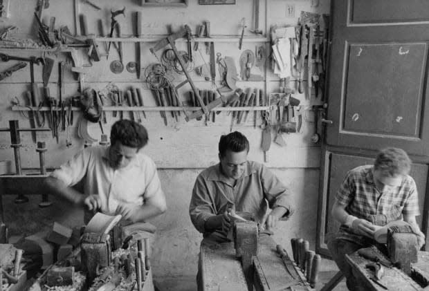 Craftsmen at work in a Florence shoe factory in 1955.