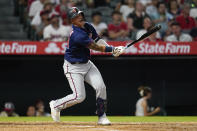 Minnesota Twins designated hitter Jose Miranda (64) reacts as he flies out to center during the fifth inning of a baseball game against the Los Angeles Angels in Anaheim, Calif., Friday, Aug. 12, 2022. (AP Photo/Ashley Landis)