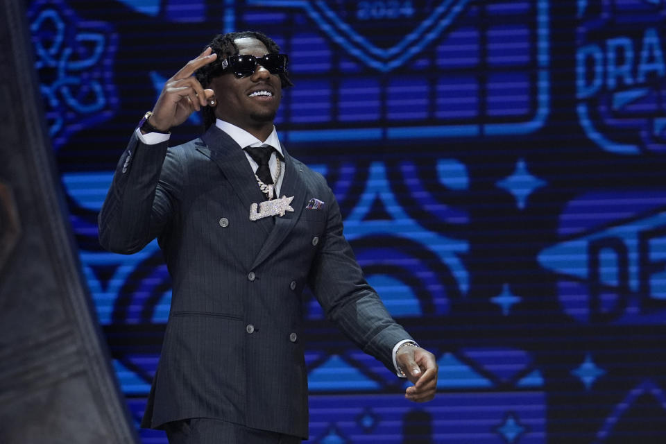 Toledo cornerback Quinyon Mitchell walks on stage during the first round of the NFL football draft, Thursday, April 25, 2024, in Detroit. (AP Photo/Jeff Roberson)