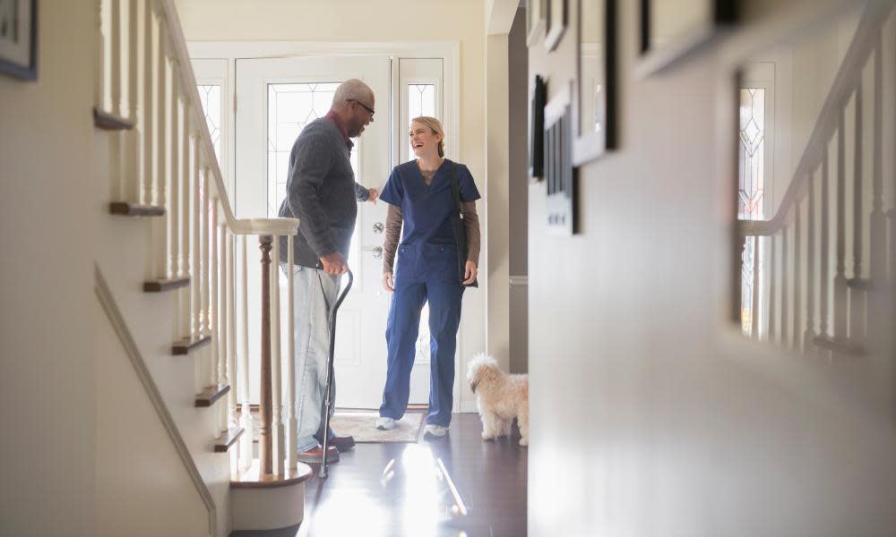 Nurse and patient talking in hallway