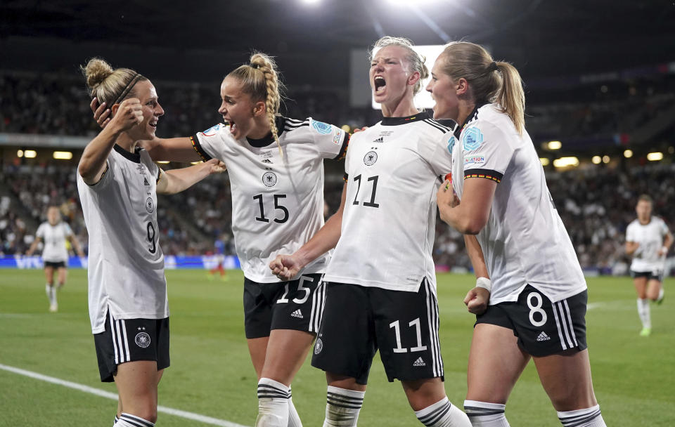 Germany's Alexandra Popp, second right, celebrates scoring her side's second goal during the Women Euro 2022 semifinal soccer match between Germany and France at Stadium MK in Milton Keynes, England, Wednesday, July 27, 2022. (Nick Potts/PA via AP)