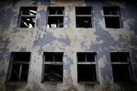 A destroyed building is pictured in Gavrilo Princip's hometown Bosansko Grahovo, January 31, 2014. REUTERS/Dado Ruvic