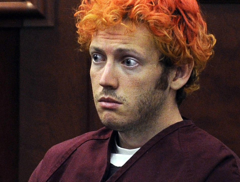 FILE - In this July 23, 2012, file photo, James Holmes, who was convicted of killing 12 moviegoers and wounding 70 more in a shooting spree in a crowded theatre in 2012, sits in Arapahoe County District Court in Centennial, Colo. In a new book and an interview with The Associated Press, psychiatrist William H. Reid, who spent hours talking with Holmes, says what led Holmes to open fire was a vortex of his mental illness, his personality and his circumstances, along with other, unknown factors. (RJ Sangosti/The Denver Post via AP, Pool, File)