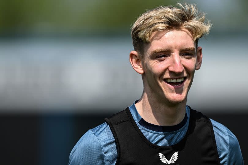 Anthony Gordon smiles during a Newcastle United training session