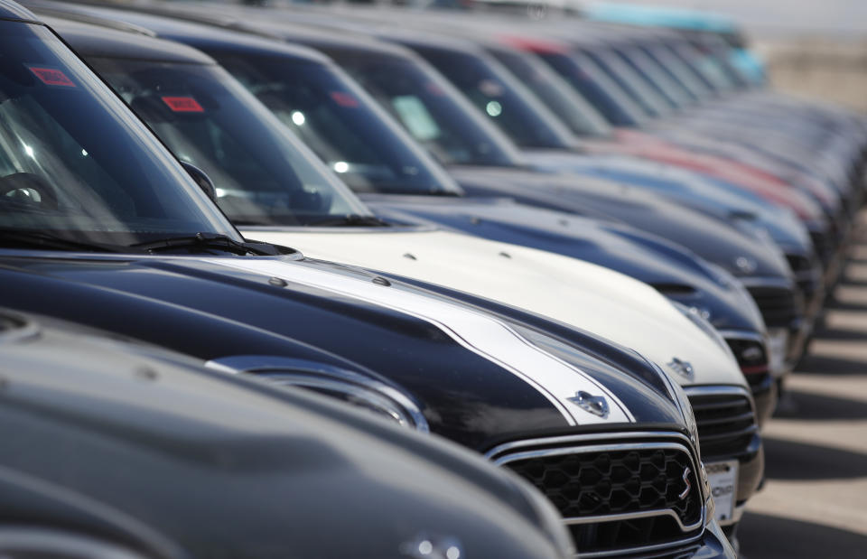 FILE- In this March 12, 2018, file photo a long row of 2018 Countryman models is shown at a Mini Cooper dealership in Highlands Ranch, Colo. Car owners with poor credit can pay hundreds, if not thousands, more to drive than those with good credit. To get the best rate possible, before heading to a dealership, check your credit scores and get pre approved for an auto loan. (AP Photo/David Zalubowski, File)