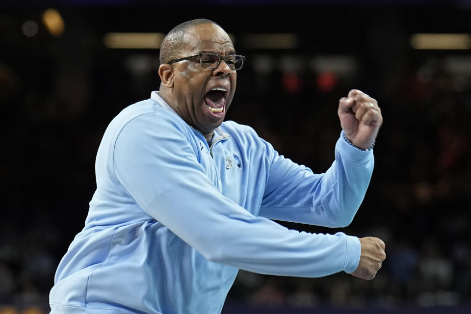 FILE - North Carolina coach Hubert Davis reacts during the second half of a college basketball game against Kansas in the finals of the NCAA men's college basketball tournament, April 4, 2022, in New Orleans. Four starters return from a team that showed off its best-case potential, while Davis has restocked a roster that was largely down to relying on an “Iron Five” starting lineup to close last year. (AP Photo/Brynn Anderson, File)