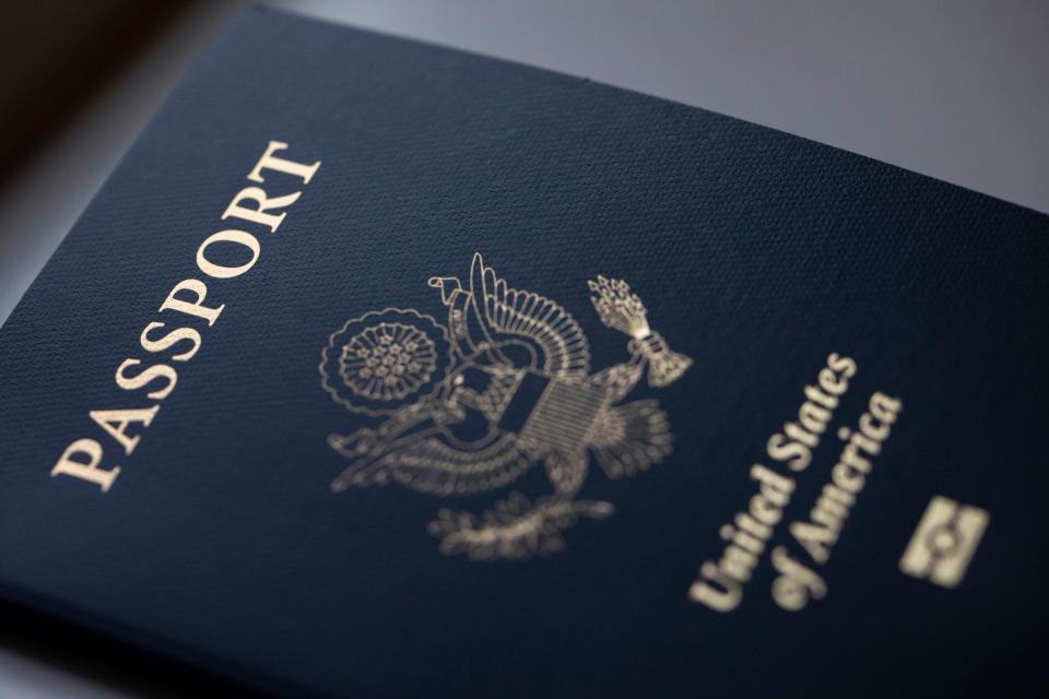 The cover of a U.S. Passport is displayed in Tigard, Ore., Saturday, Dec. 11, 2021.