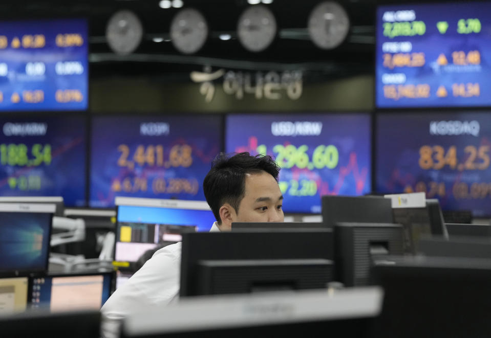 A currency trader watches monitors at the foreign exchange dealing room of the KEB Hana Bank headquarters in Seoul, South Korea, Wednesday, March 29, 2023. Asian stocks were mixed Wednesday as anxiety about the global financial system began to fade following three high-profile bank failures.(AP Photo/Ahn Young-joon)