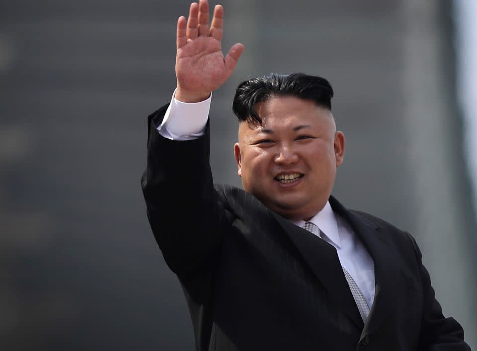 North Korean leader Kim Jong-Un greeting crowds at a parade in Pyongyang. Photo: AP