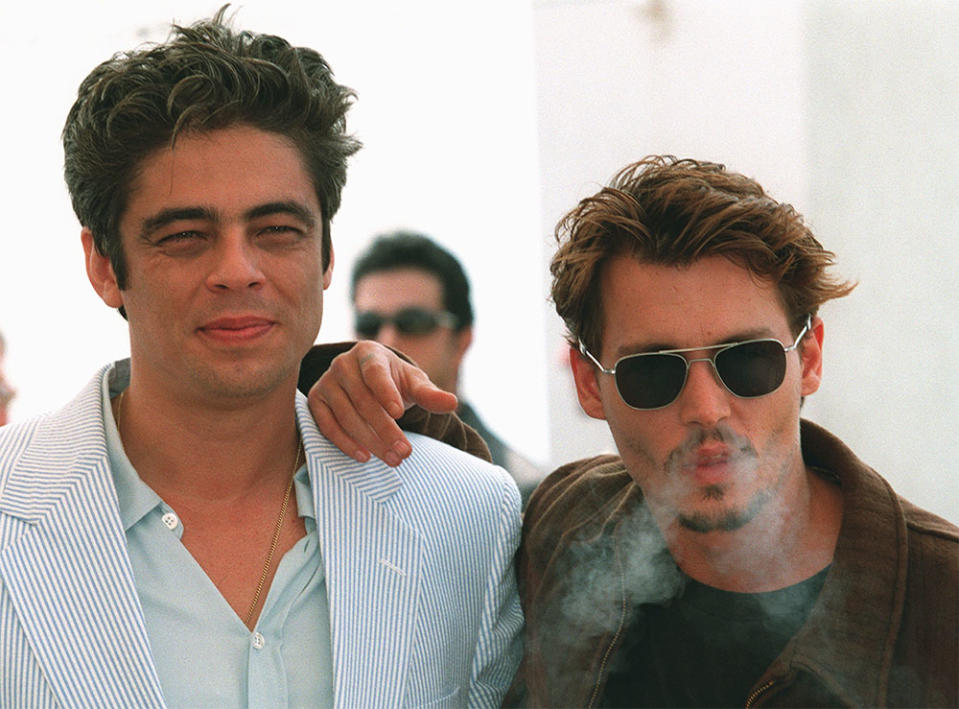 Benicio Del Toro and Johnny Depp pose for photographers during a photocall for their film "Fear and Loathing in Las Vegas" directed by Terry Gilliam, 15 May at the Palais des festivals. The film is shown today in competition at the 51st Cannes film festival.