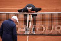 Taylor Fritz of the United States checks a line call during the final match against Jan-Lennard Struff of Germany at the Tennis ATP tournament in Munich, Germany, Sunday, April 21, 2024. (AP Photo/Matthias Schrader)
