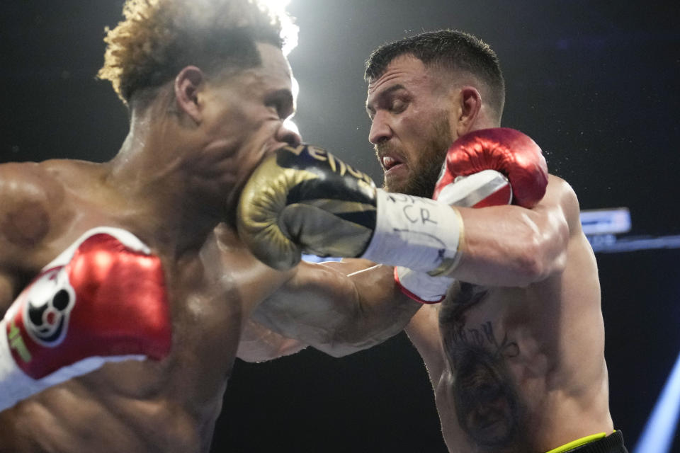 Devin Haney, left, fights Vasiliy Lomachenko in an undisputed lightweight championship boxing match Saturday, May 20, 2023, in Las Vegas. Haney won by unanimous decision. (AP Photo/John Locher)