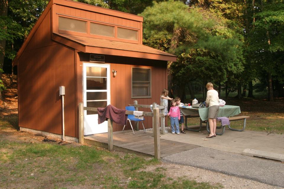 Campers in many state parks can rent a tent, tepeee, group cabin or a mini cabin, like this one at Ludington State Park.