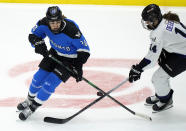 Toronto's Sarah Nurse (20) and Minnesota's Clair DeGeorge (14) vie for the puck during the second period of Game 1 of a PWHL hockey playoffs semifinal Wednesday, May 8, 2024, in Toronto. (Frank Gunn/The Canadian Press via AP)